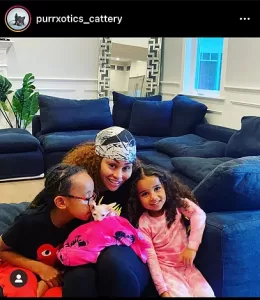 Purrxotics family with adopted Sphynx kitten
