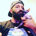 Purrxotics customer with adopted Sphynx kitten